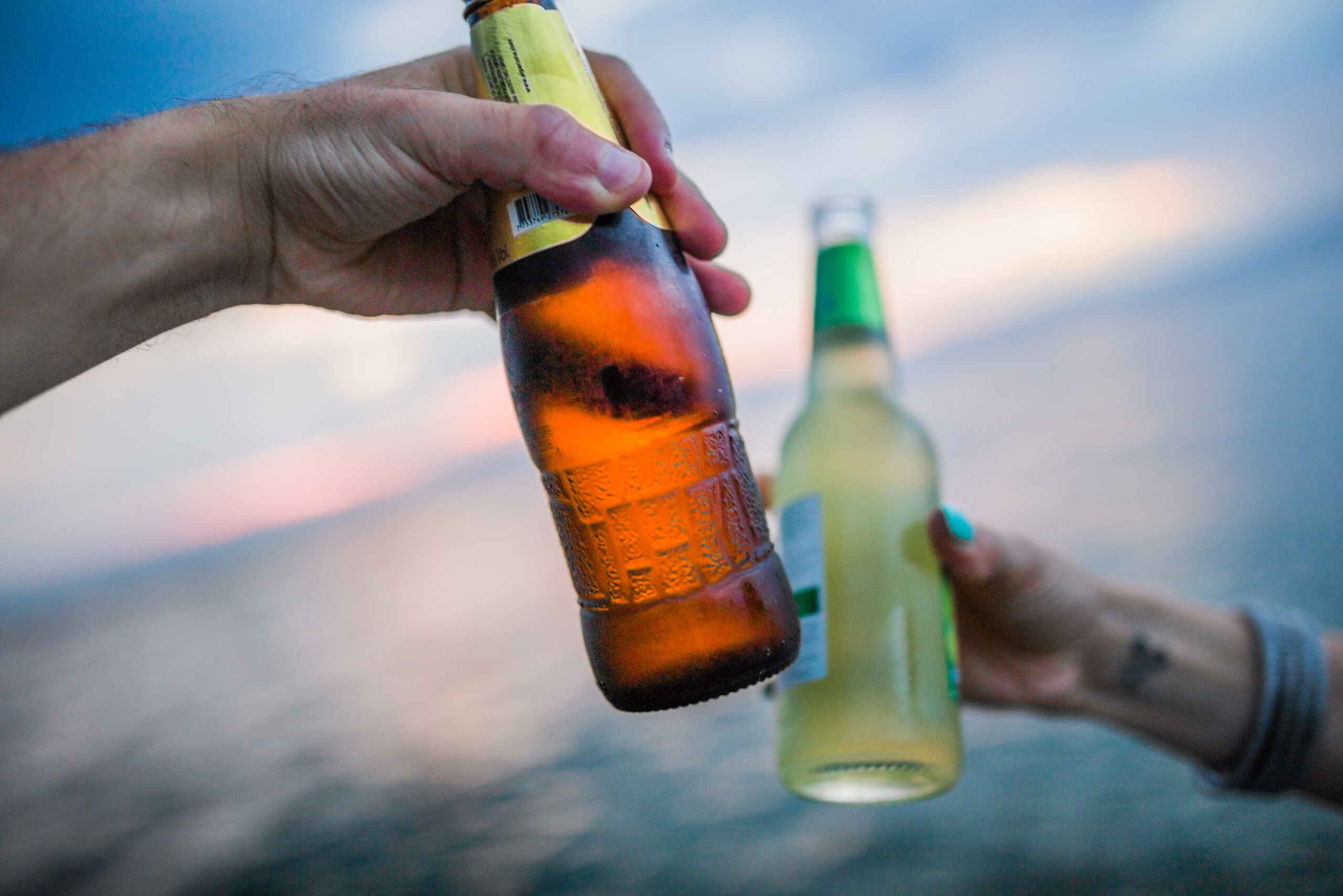 two cold beers clinking
